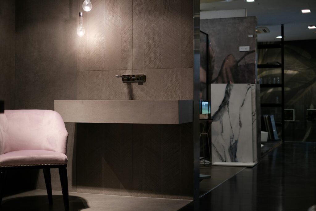 Various plumbing fixtures including faucets and sinks arranged in a showroom