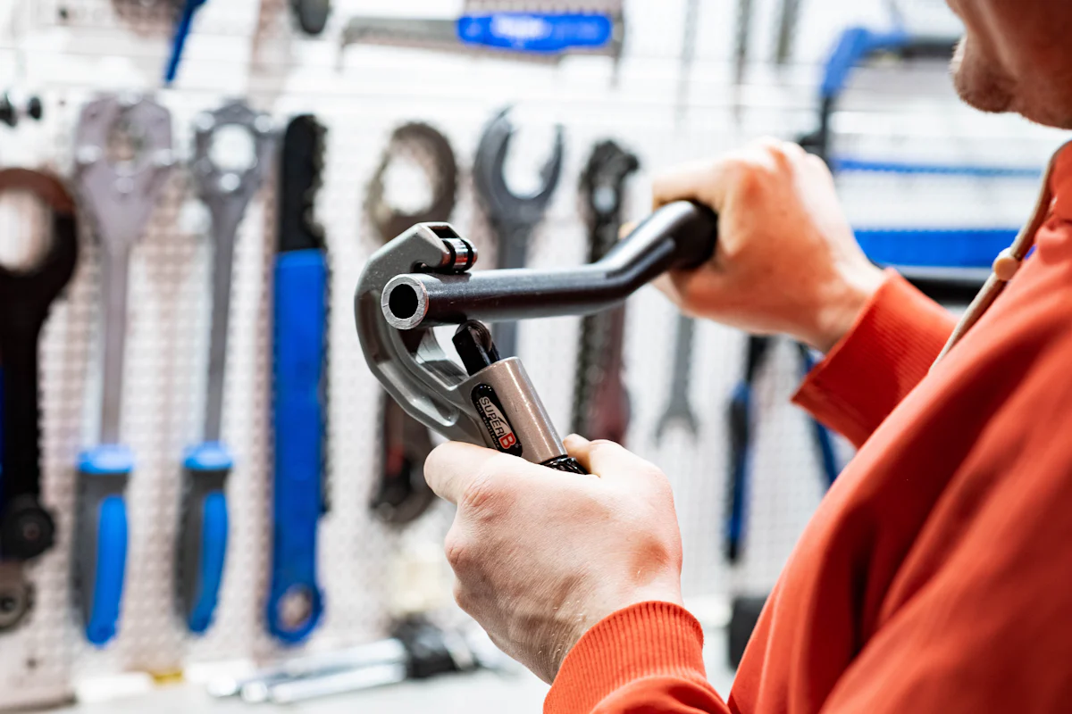 Plumber using a pipe wrench – professional plumbing services in London by Catalyst Home Services